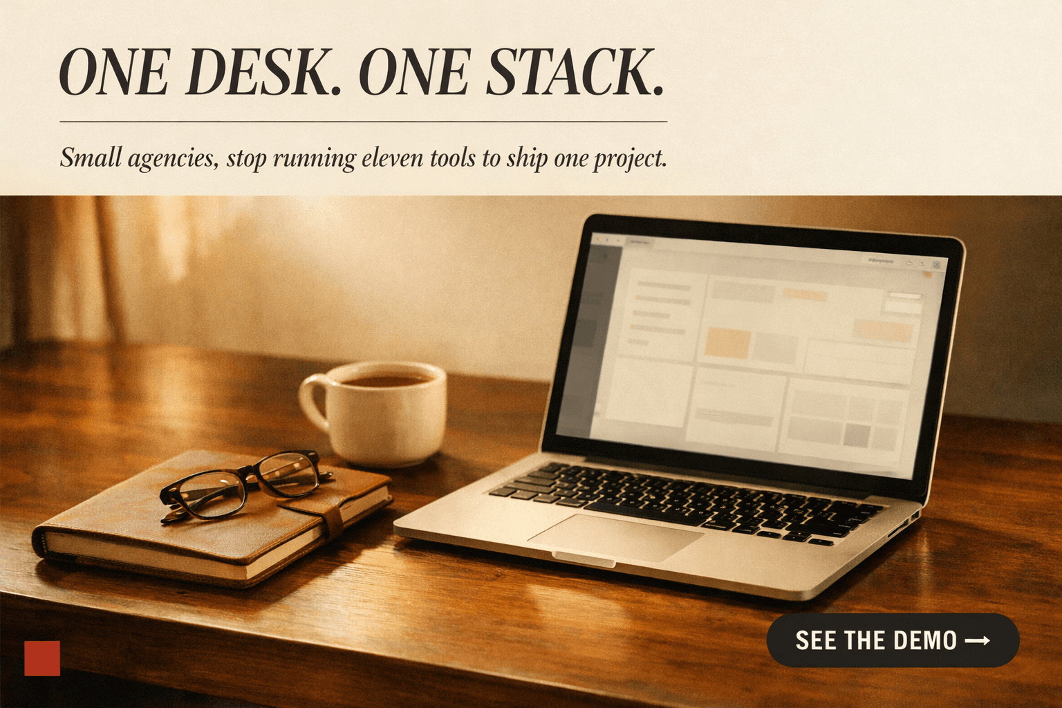 LinkedIn promoted ad specimen: warm desk scene with laptop and notebook, headline 'ONE DESK. ONE STACK.'